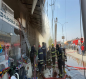 بالصور:حريق بمجمع تجاري في كربلاء والدفاع المدني يتدخل