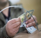 انخفاض أسعار الدولار مقابل الدينار في العراق