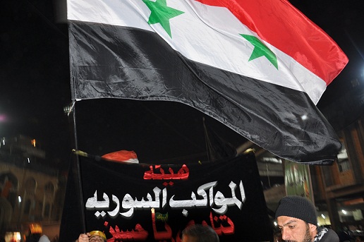 الاعلام الوطنية السورية تجوب شوارع كربلاء المقدسة (مصور)