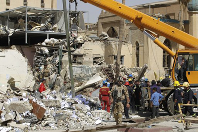 صور من التفجير الذي استهدف الوقف الشيعي في بغداد