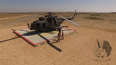 بالصور:فرقة العباس القتالية تفتتح مهبط للطائرات المروحية في كربلاء، ومظلييها ينفذون قفزة عسكرية