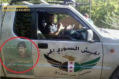 سوريا :عصابات الجيش الحر يرفعون صور صدام على عجلاتهم +صورة