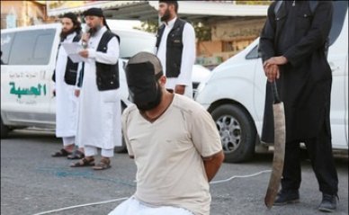 داعش" يعدم طياراً و ناشطا سياسيا في الموصل
