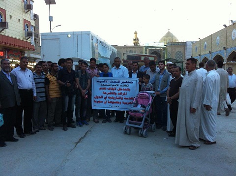 إعلاميو النجف ومواطنون يطالبون الأمم المتحدة بالتدخل لوقف تهديم المراقد المقدسة+صورة