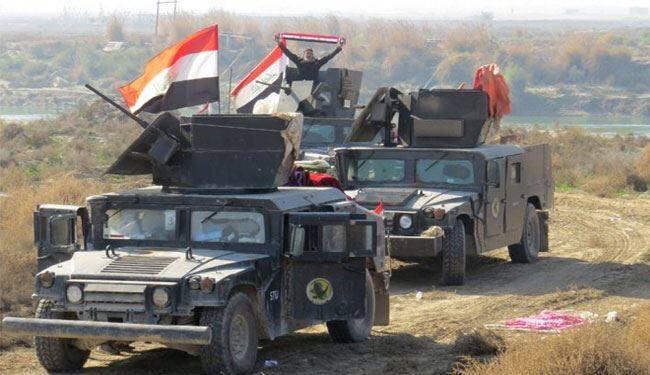 جهاز مكافحة الارهاب يحرر القرية العصرية جنوب هيت ويرفع العلم العراقي فيها