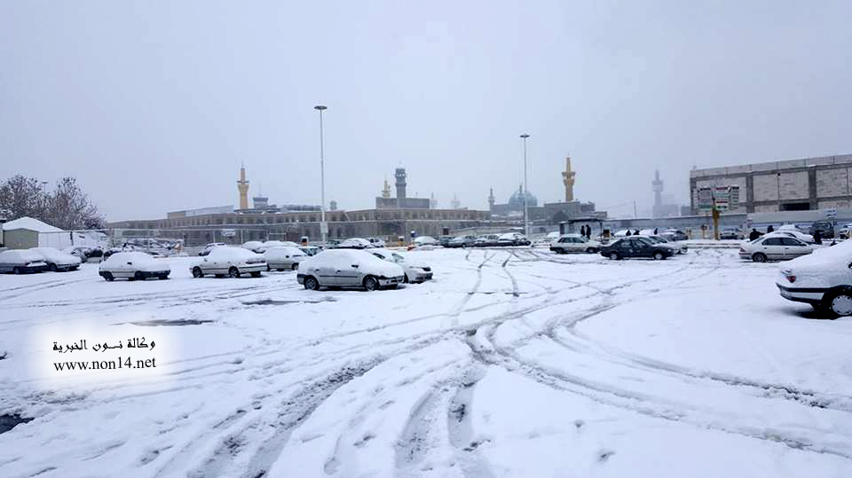 بالصور: الثلوج تغطي حرم الامام الرضا (ع)