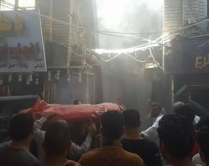 بالصور: النيران تشتعل في محال تجارية وسط مدينة النجف