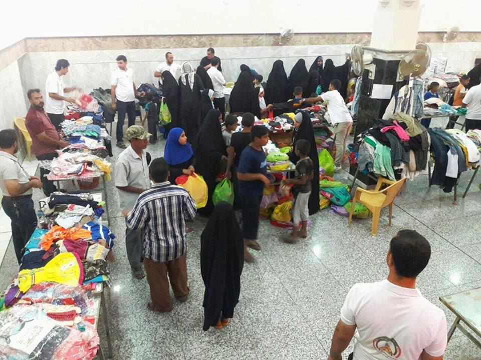 بالصور : سوق مجاني لعوائل شهداء الحشد الشعبي بالنجف الاشرف