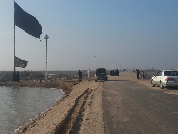 بالصور :راية الإمام الحسين عليه السلام في ابعد نقطة من العراق