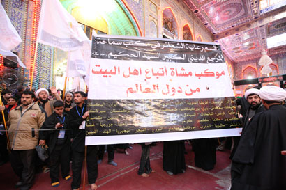 موكب يضم 60 جنسية عالمية يشارك باربعينية الامام الحسين في كربلاء (مصور)