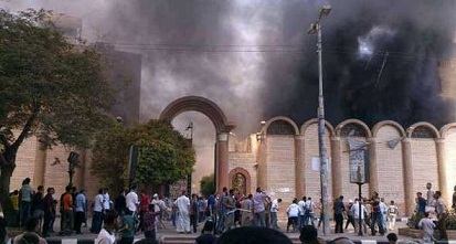 الإخوان يشعلون النار فى كنيسة وسيارة شرطة بسوهاج+صورة