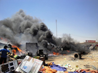 حريق في النجف يلتهم مخازن للاجهزة الكهربائية وخسائر بمئات الملايين(مصور)