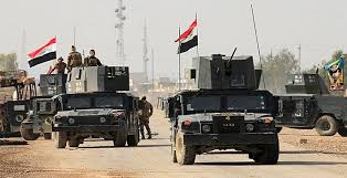 بعد ان أغلقتها داعش … القوات الامنية تفتح شوراع أيمن الموصل وتطمر الخنادق