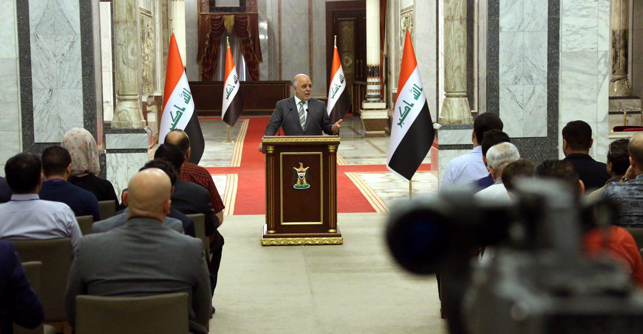 العبادي: نعمل على تأمين الطريق الدولي بين بغداد وعمان