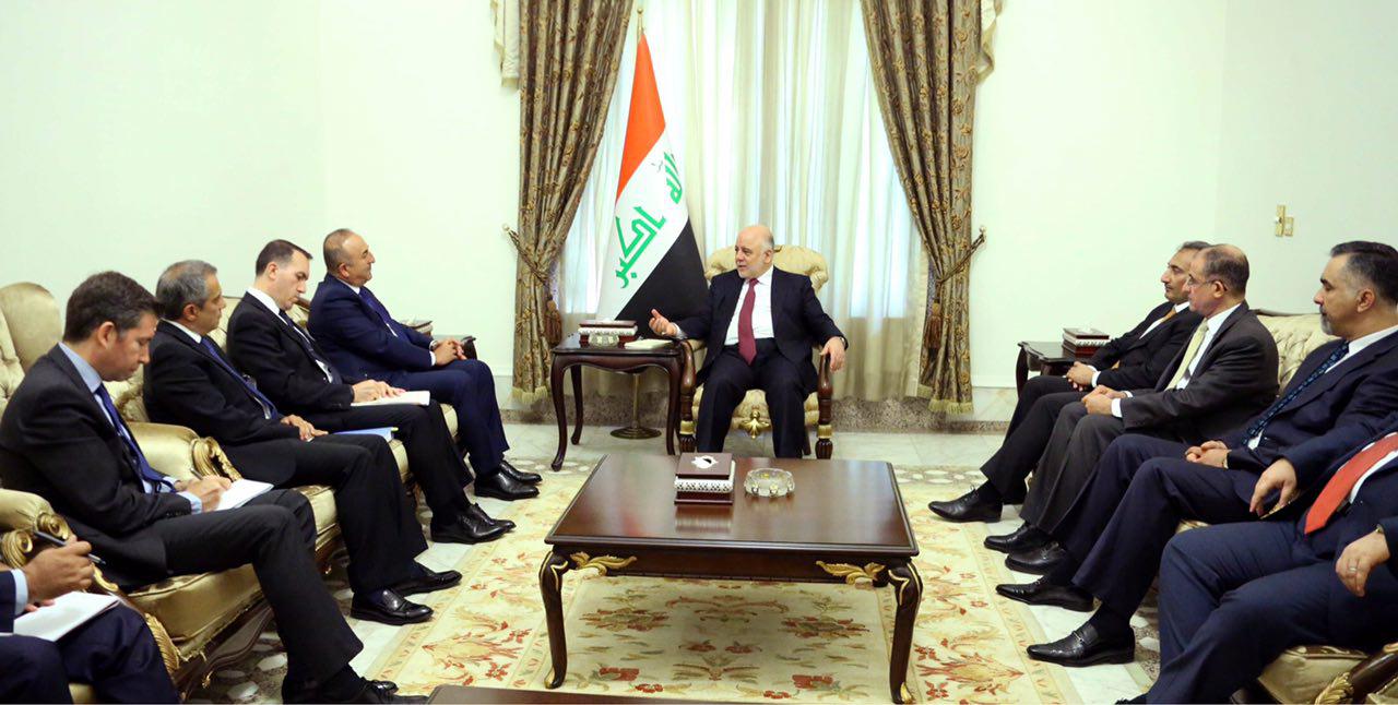 العبادي يؤكد لأوغلو ضرورة الإسراع بسحب القوات التركية من العراق