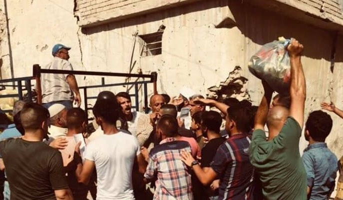 بالصور:مساعدات انسانية لسكان مدينة الموصل المنكوبة من كربلاء