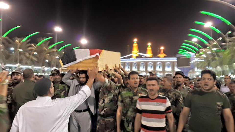 شهيد من ابناء الرمادي  يشيع ويدفن  في كربلاء (مصور)