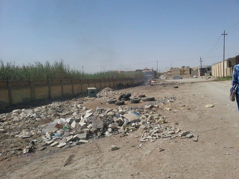 بالصور :شوارع في كربلاء تصبح مكبا للنفايات