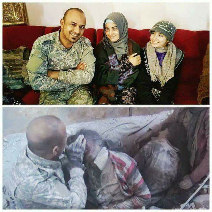 صورة لمقاتل عراقي انقذ عائلة من تحت الانقاض بالموصل وبعد فترة اخذ معهم صورة