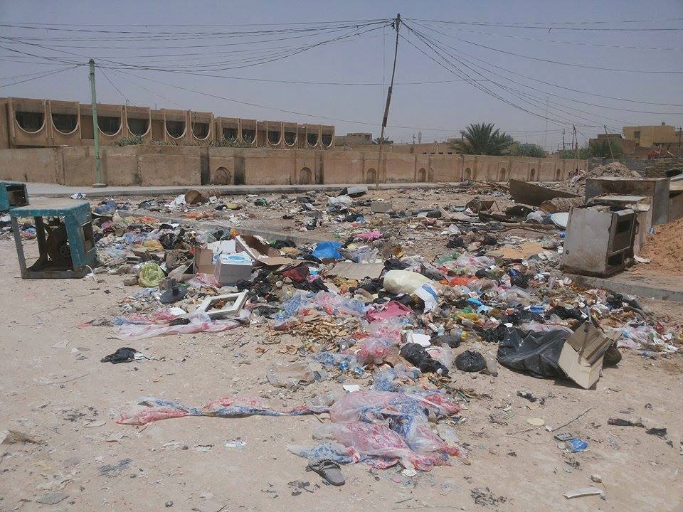 غياب عمال النظافة وراء انتشار النفايات في حي العامل وسط كربلاء