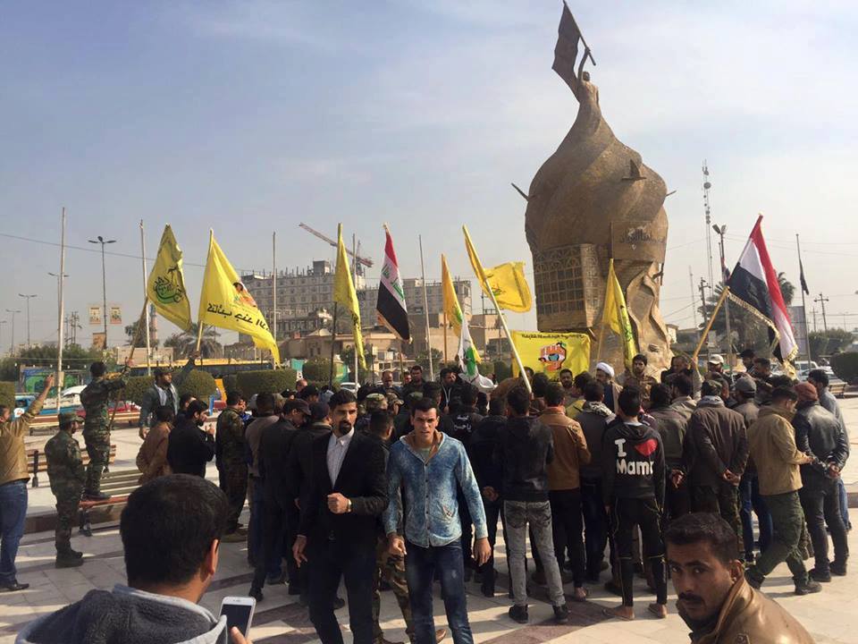 فصيل  قتالي في كربلاء يحتفل بتحرير مدينة حلب السورية