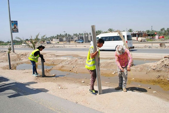 وزارة الاعمار والاسكان والبلديات العامة تباشر بتنفيذ سياج وقائي على طريق كربلاء المقدسة - بغداد