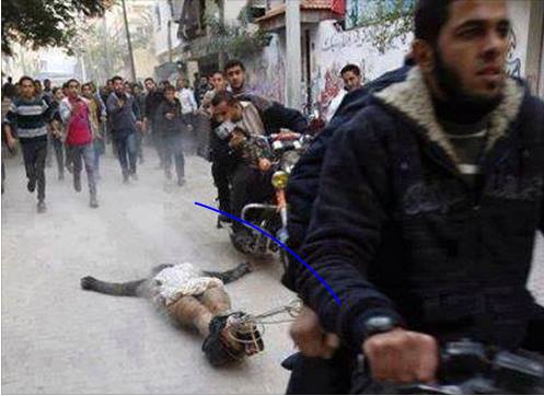 سلفيو مصر وبدعم حكومي يمثلون بجثة قيادي شيعي ويسحبوها بالشوارع +صورة