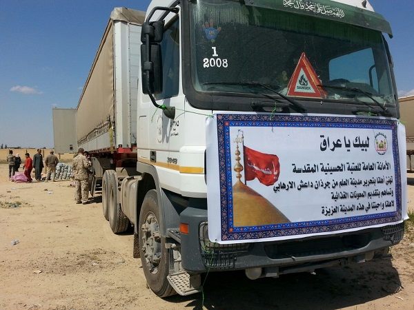 بالصور:العتبة الحسينة المقدسة توزع المواد الغذائية لـــ(850 عائلة) في ناحية العلم بالمحافظة صلاح الدين