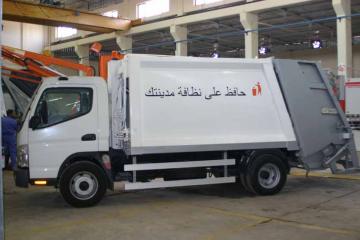 تسيير كابسات النفايات في شوارع بغداد بنظام البطاقة المجانية التي توزع على المواطنين