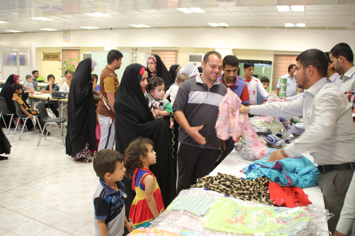 بالصور:العتبة الحسينية توزع كسوة العيد على 35000 الف نازح ومهجر