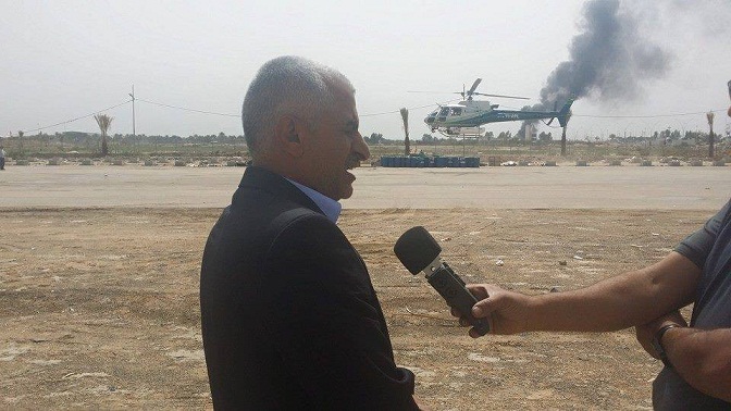 بالصور: حملة مكافحة حشرة الدوباس في بساتين النخيل في كربلاء