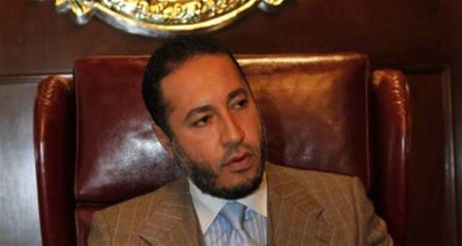 نجل القذافي يعتذر للشعب الليبي