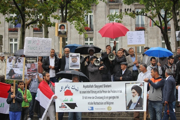 بالصور:العراقيون في المانيا يتظاهرون وسط الامطار الغزيرة دعما لجيشهم الباسل في محاربة الارهاب