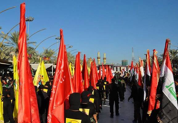 بالصور:الحشد الشعبي يستعرض في كربلاء لتجديد الولاء لأبي الاحرار “ع”