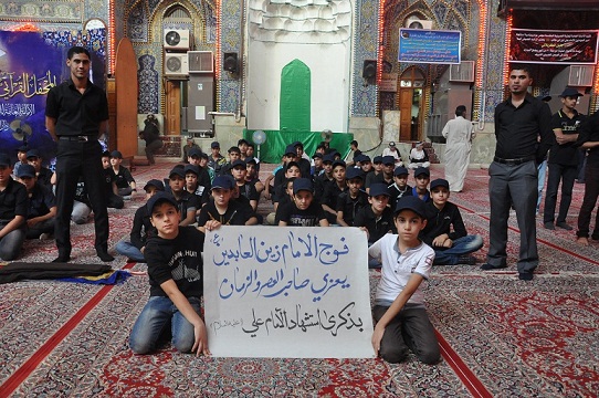 كشافة الامام الحسين يحيي ذكرى شهادة  امير المؤمنين عليه السلام عند مرقد الامام الحسين في كربلاء (مصور)