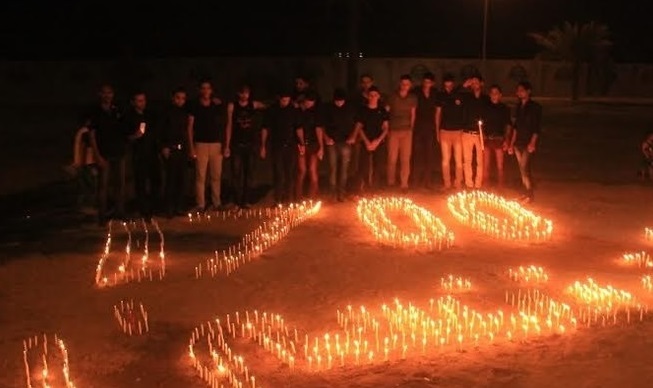 شباب كربلائيون يضيئون 1700 شمعة ترحما لشهداء سبايكر