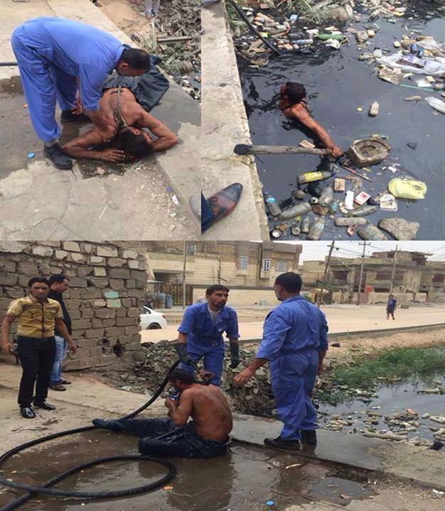 موظف في مجاري البصرة  يسبح في مياه المجاري لانجاز عمله بشرف ونزاهة شاهدوا الصور ؟!!