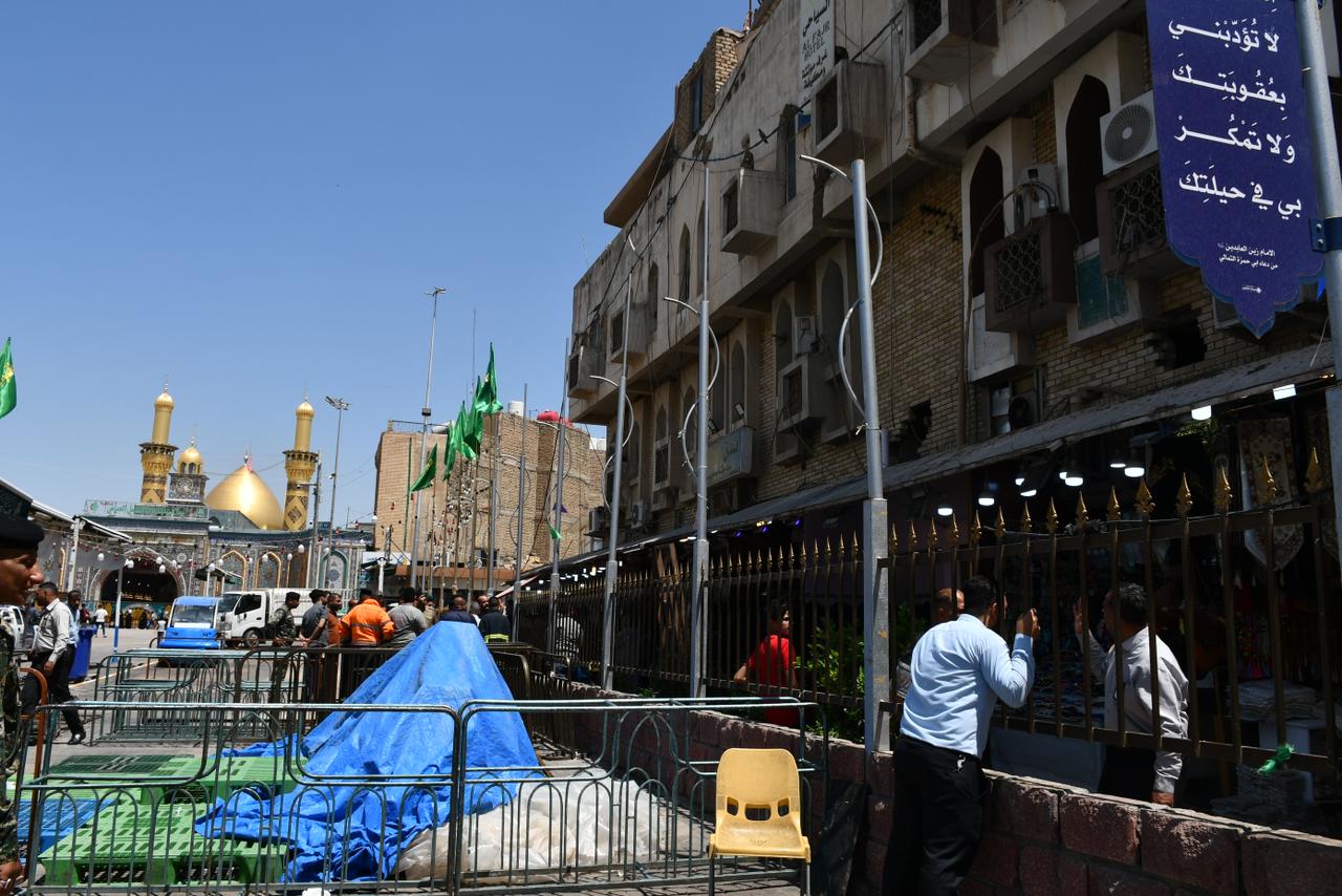 الدفاع المدني يغلق بناية آيلة للسقوط وسط كربلاء (صور)