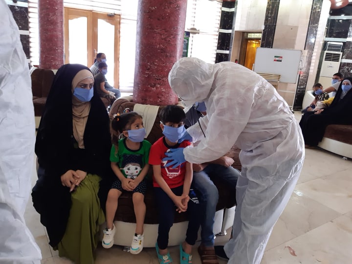 بالصور:مُغادرة ( 293 ) مُلامساً مع مُصابي كُورونا من الحجر الصحي في كربلاء