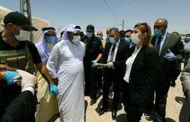 وزيرة الهجرة والمهجرين تتفقد عددا من العوائل العائدة في مساكنهم بمدينة الفلوجة