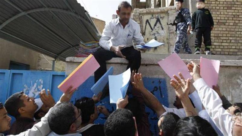 القبض على مجموعة من المعقبين في بغداد بتهمة الاحتيال في إصدار جوازات السفر الإلكترونية