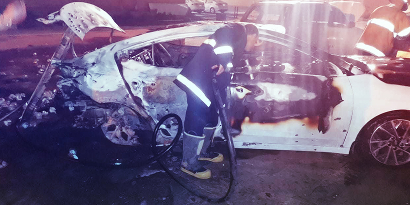 مسلحان يحرقان عجلات في ميسان