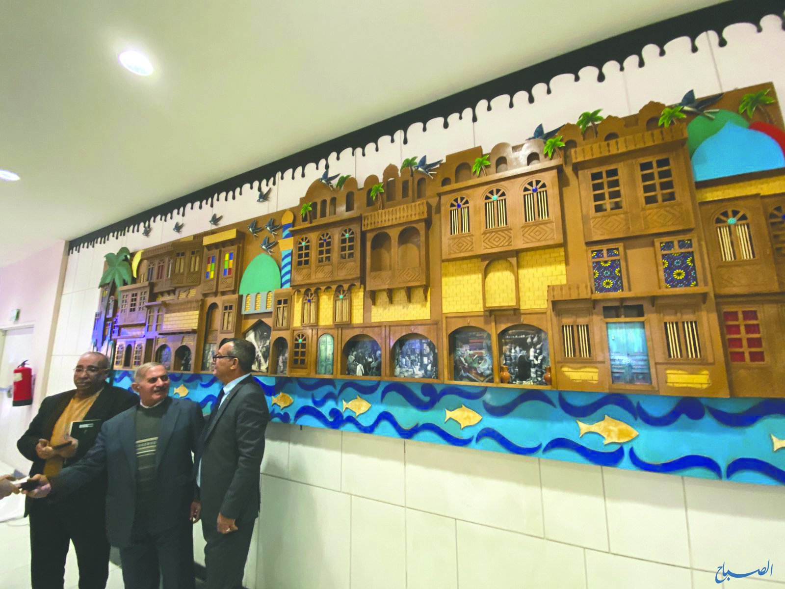 جدارية خشبية تجسّد مدينة الحلة