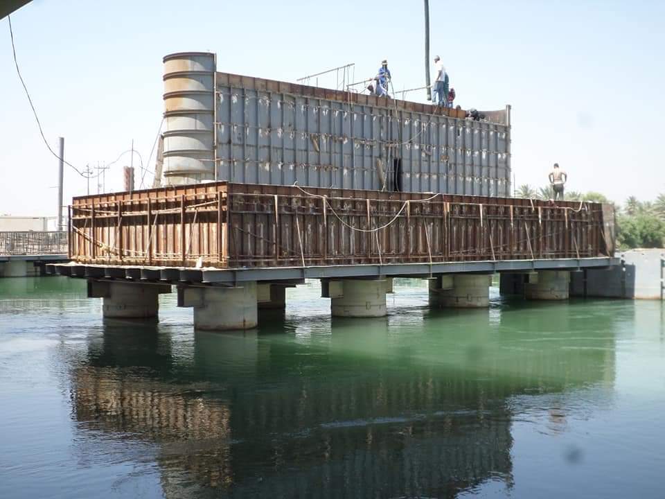 بالصور.. وزارة الاعمار تواصل اعمال مشروع جسر الحلة الشمالي